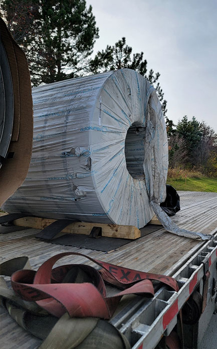 Spokane flatbed trailer hauling a heavy steel coil